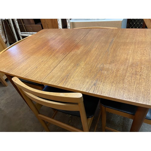 146 - TEAK EXTENDING DINING TABLE AND SIX BEECH LADDER BACK DINING CHAIRS