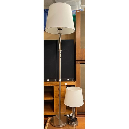 23 - POLISHED STEEL BARLEY TWIST LAMP STANDARD AND MATCHING TABLE LAMP