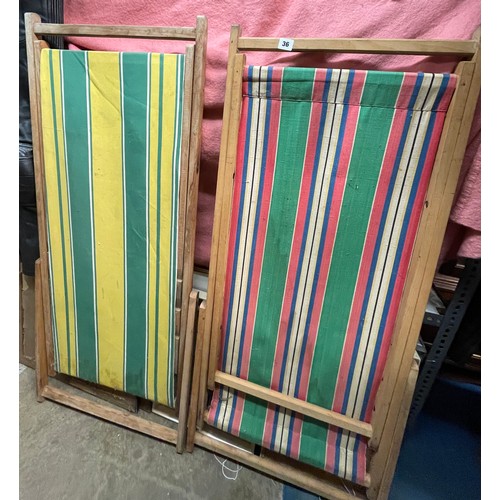 36 - TWO CANDY STRIPED FOLDING DECK CHAIRS