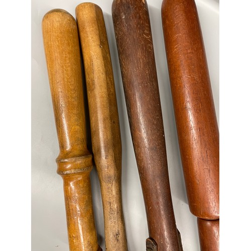 315 - FOUR CARVED TURNED WOODEN TRUNCHEONS