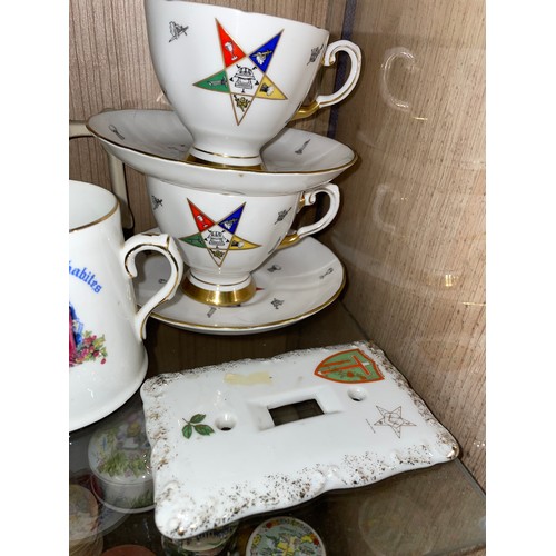 317 - SHELF OF MASONIC LODGE CERAMIC MUGS, TEACUP DUOS, LIGHT SWITCH COVER AND GLASS PIN DISH