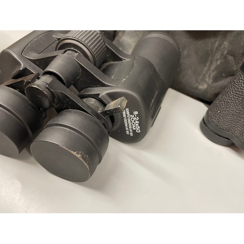 424 - PAIR OF HALINA 8X30 BINOCULARS AND 8-24X50 ZOOM BINOCULARS