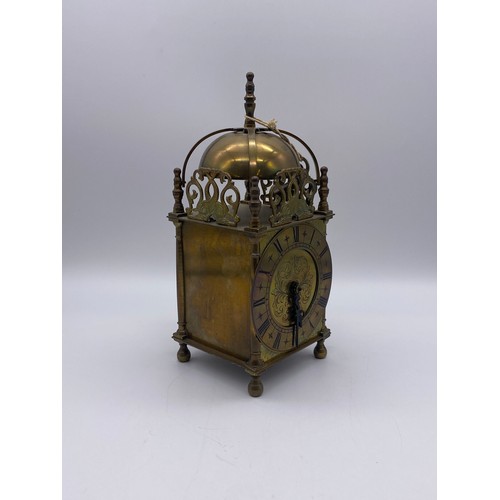 515 - REPRODUCTION BRASS LANTERN CLOCK WITH KEY