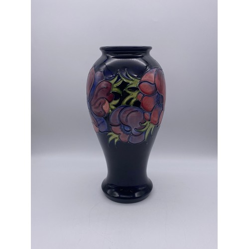 505 - MOORCROFT POTTERY ANEMONE BALUSTER VASE ON DARK BLUE GROUND