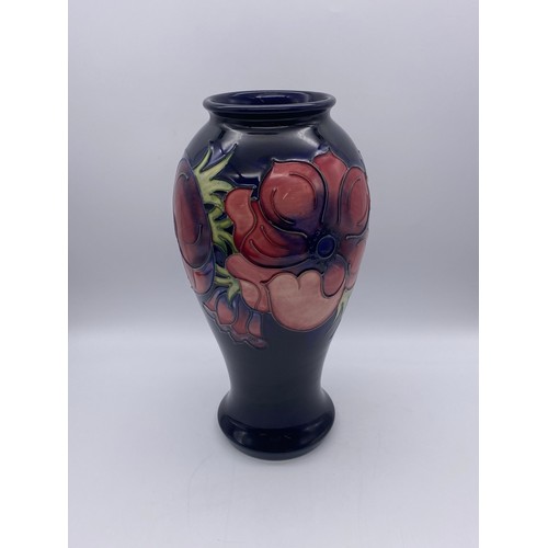 505 - MOORCROFT POTTERY ANEMONE BALUSTER VASE ON DARK BLUE GROUND