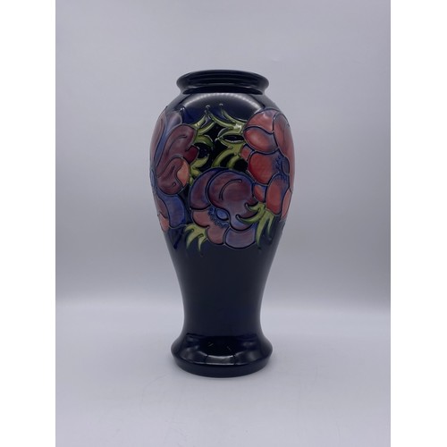 505 - MOORCROFT POTTERY ANEMONE BALUSTER VASE ON DARK BLUE GROUND