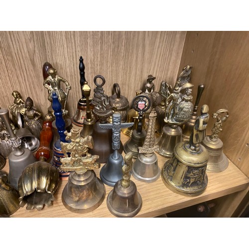 331 - SHELF OF DECORATIVE BRASS FIGURAL BELLS