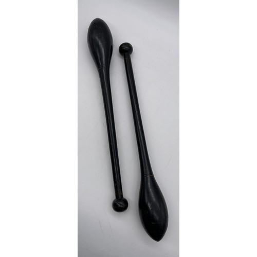 583 - PAIR OF EBONISED JUGGLING CLUBS