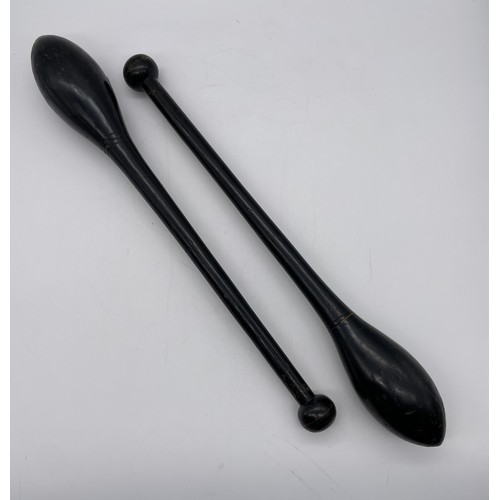 583 - PAIR OF EBONISED JUGGLING CLUBS