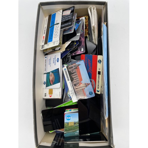 599 - SHOE BOX OF VARIOUS TELECOM AND NETWORK PHONE CARDS