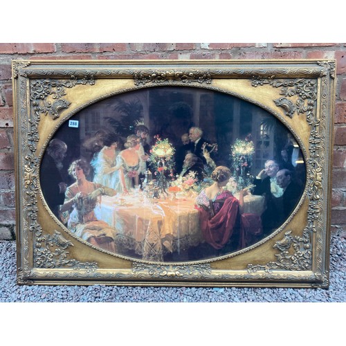 288 - LITHOGRAPHIC PRINT OF THE DINNER PARTY IN ORNATE GILT CARVED FRAME