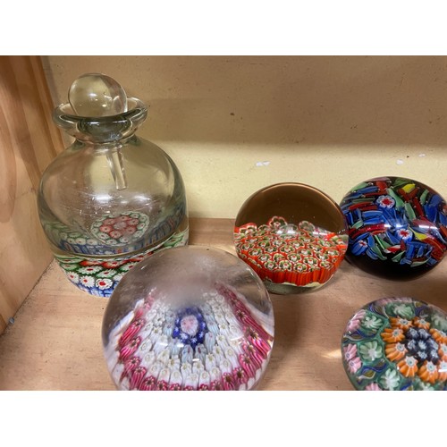 528 - SHELF OF GLASS CANE WORK AND MILLEFIORI PAPER WEIGHTS AND INK WELL