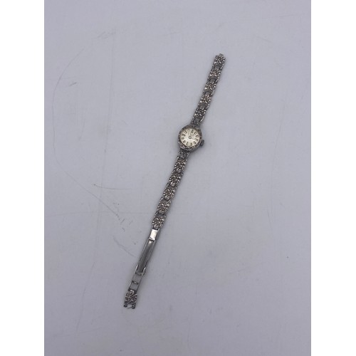 581 - SILVER CASED BARK EFFECT AVIA WRIST WATCH