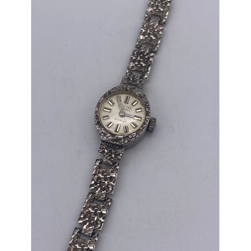 581 - SILVER CASED BARK EFFECT AVIA WRIST WATCH