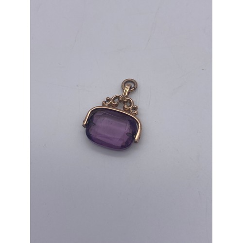 571 - 9CT ROSE GOLD MOUNTED AMETHYST SWIVEL FOB