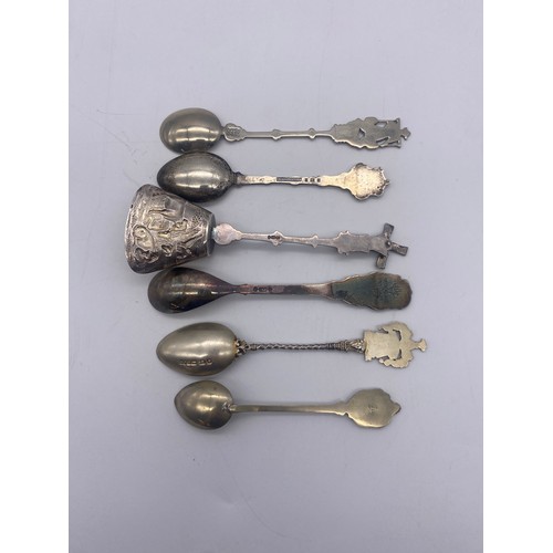 579 - BAG OF NOVELTY ENAMEL FINIAL TEASPOONS AND SUGAR TONGS (SOME SILVER)