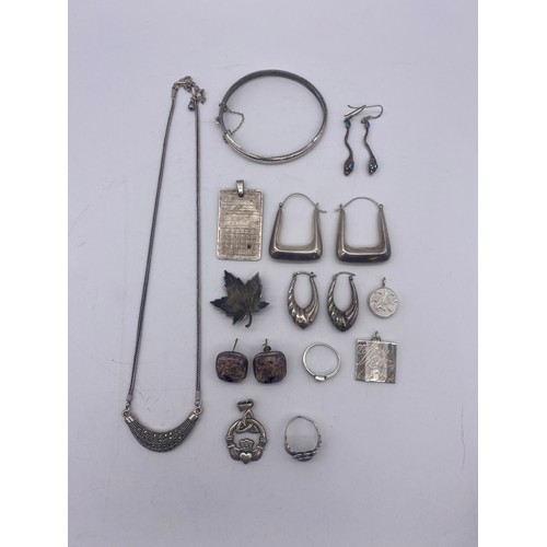 582 - SILVER AND WHITE METAL PENDANTS, ANGULAR HOOP EARRINGS, MARCASITE CRESCENT NECKLACE AND BADGES