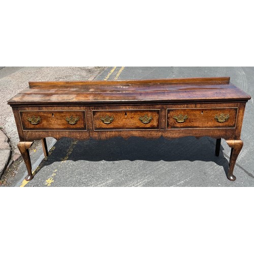 211 - MID 18TH CENTURY OAK DRESSER BASE FITTED WITH THREE CROSS BANDED DRAWERS WITH A  SHAPED APRON ON CAB... 