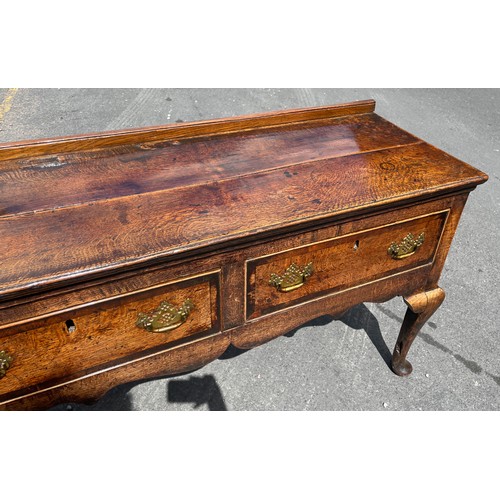 211 - MID 18TH CENTURY OAK DRESSER BASE FITTED WITH THREE CROSS BANDED DRAWERS WITH A  SHAPED APRON ON CAB... 