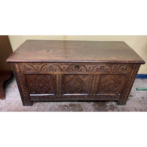 198 - 18TH CENTURY OAK THREE PANEL COFFER CARVED WITH ROUNDELS AND LOZENGES L105.5CM H54.5CM W47.5CM