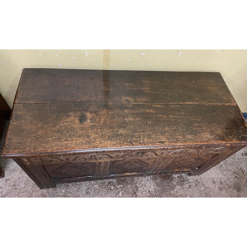 198 - 18TH CENTURY OAK THREE PANEL COFFER CARVED WITH ROUNDELS AND LOZENGES L105.5CM H54.5CM W47.5CM