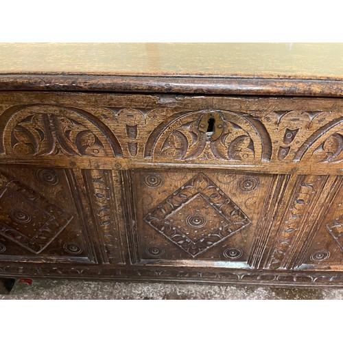 198 - 18TH CENTURY OAK THREE PANEL COFFER CARVED WITH ROUNDELS AND LOZENGES L105.5CM H54.5CM W47.5CM