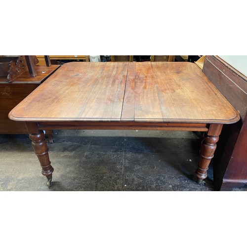 80 - VICTORIAN MAHOGANY EXTENDING DINING TABLE WITH ROUNDED MOULDED EDGE ON TAPERED RING TURNED LEGS WITH... 