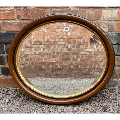 590 - OVAL WOOD AND GILT LINED MIRROR