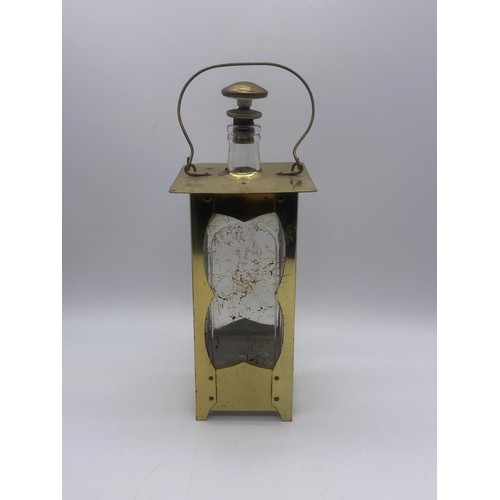 604 - ARTS AND CRAFTS STYLE BRASS CASED DECANTER IN THE FORM OF A LAMP