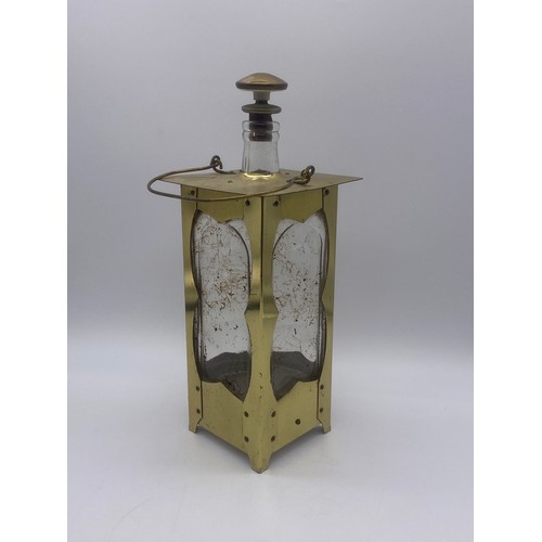 604 - ARTS AND CRAFTS STYLE BRASS CASED DECANTER IN THE FORM OF A LAMP