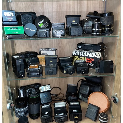 612 - THREE SHELVES OF CAMERA LENSES, VARIOUS FLASHES, AND FILTERS