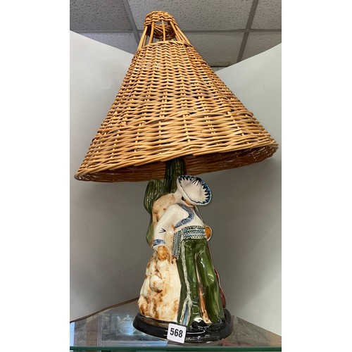 568 - MEXICAN POTTERY FIGURAL TABLE LAMP WITH CANED SHADE