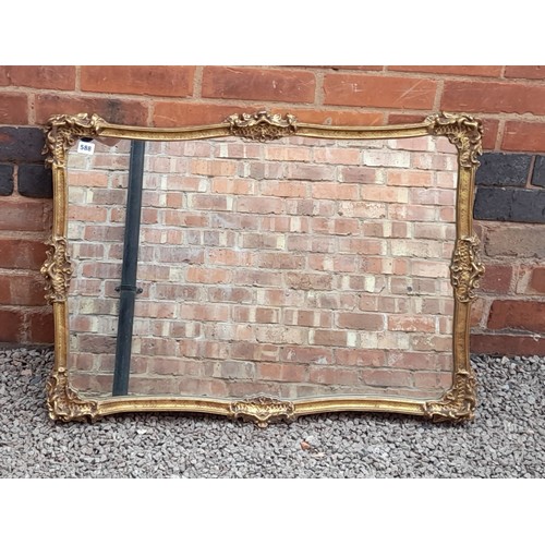 588 - GILT SWEPT FRAME MIRROR