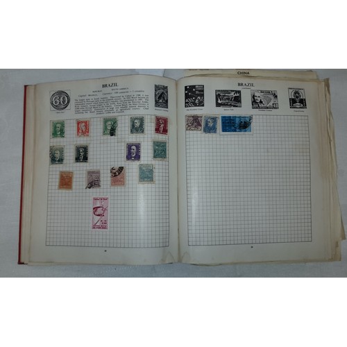 558 - STRAND POSTAGE STAMP ALBUM OF WORLD STAMPS