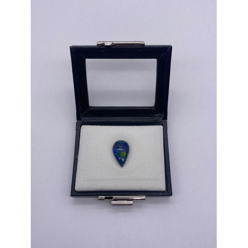 732 - NATURAL PEAR SHAPED CABOCHON OPAL DEEP BLUE WITH PLAY OF COLOUR 7.98CTS WITH GEMOLOGY CERTIFICATE