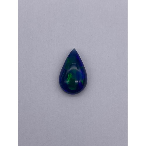 732 - NATURAL PEAR SHAPED CABOCHON OPAL DEEP BLUE WITH PLAY OF COLOUR 7.98CTS WITH GEMOLOGY CERTIFICATE