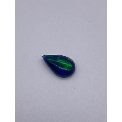 732 - NATURAL PEAR SHAPED CABOCHON OPAL DEEP BLUE WITH PLAY OF COLOUR 7.98CTS WITH GEMOLOGY CERTIFICATE