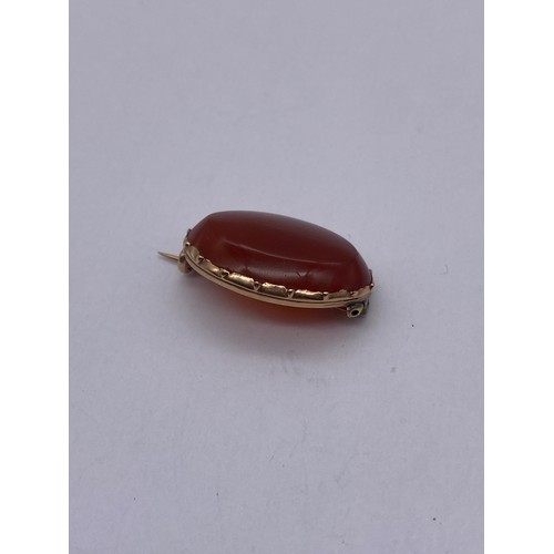 717 - ROSE METAL OVAL CARNELIAN SET BAR BROOCH 5G APPROX OVERALL