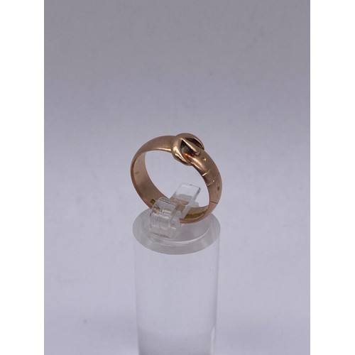 716 - 9CT ROSE GOLD BUCKLE RING SIZE 0 4G APPROX