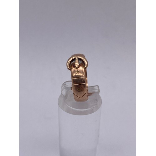 716 - 9CT ROSE GOLD BUCKLE RING SIZE 0 4G APPROX