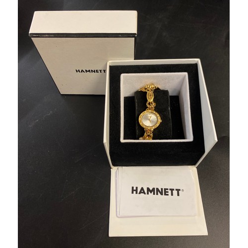 762 - BOXED HAMNETT LADIES PLATED CHARM BRACELET DRESS WATCH WITH DIAMANTE BEZEL