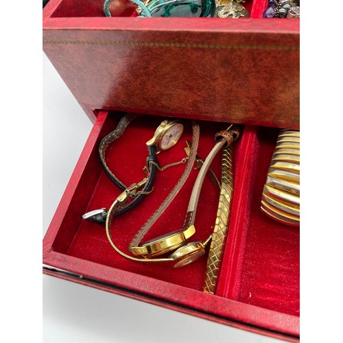 710 - RED JEWELLERY BOX WITH VARIOUS SETS OF EARRINGS, RINGS, PENDANTS AND POWDER COMPACT