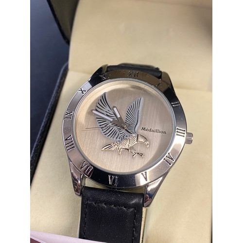 765 - BOXED MEDAILLION WRISTWATCH WITH EAGLE DIAL ON LEATHER STRAP