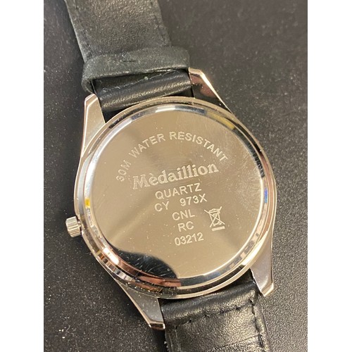 765 - BOXED MEDAILLION WRISTWATCH WITH EAGLE DIAL ON LEATHER STRAP