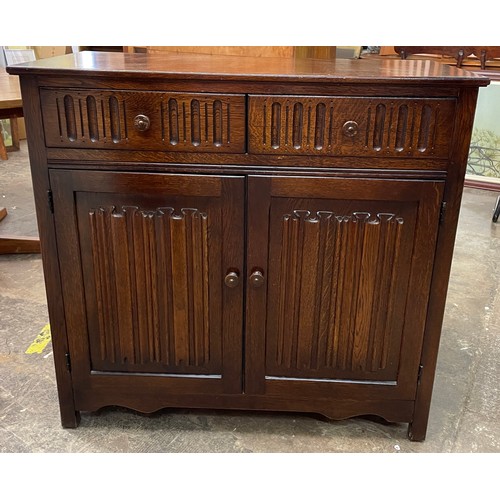 12 - OAK LINEN FOLD TWO DOOR SIDE CABINET