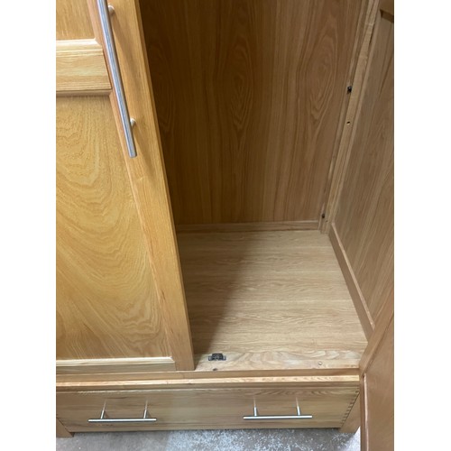 21 - CONTEMPORARY LIGHT OAK TWO DOOR WARDROBE WITH DRAWER BASE