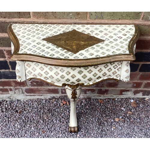 40 - PAIR OF CREAM AND GILT PAINTED SERPENTINE ITALIANATE CONSOLE TABLES