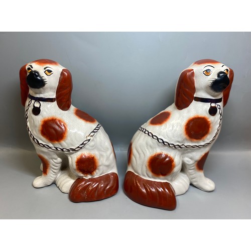 273 - REPRODUCTION PAIR OF STAFFORDSHIRE SEATED SPANIELS