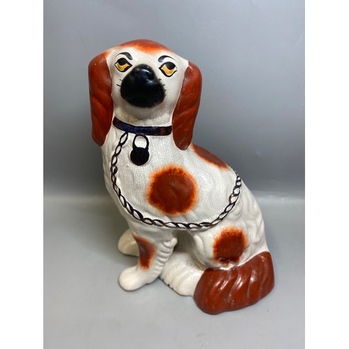 273 - REPRODUCTION PAIR OF STAFFORDSHIRE SEATED SPANIELS