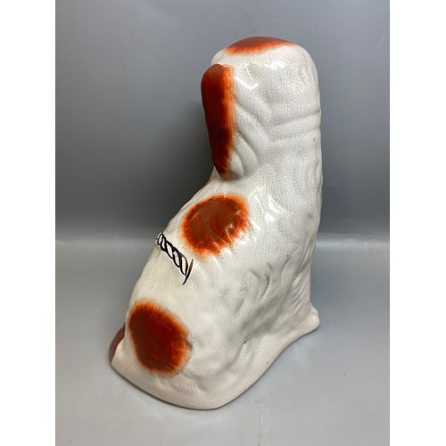 273 - REPRODUCTION PAIR OF STAFFORDSHIRE SEATED SPANIELS